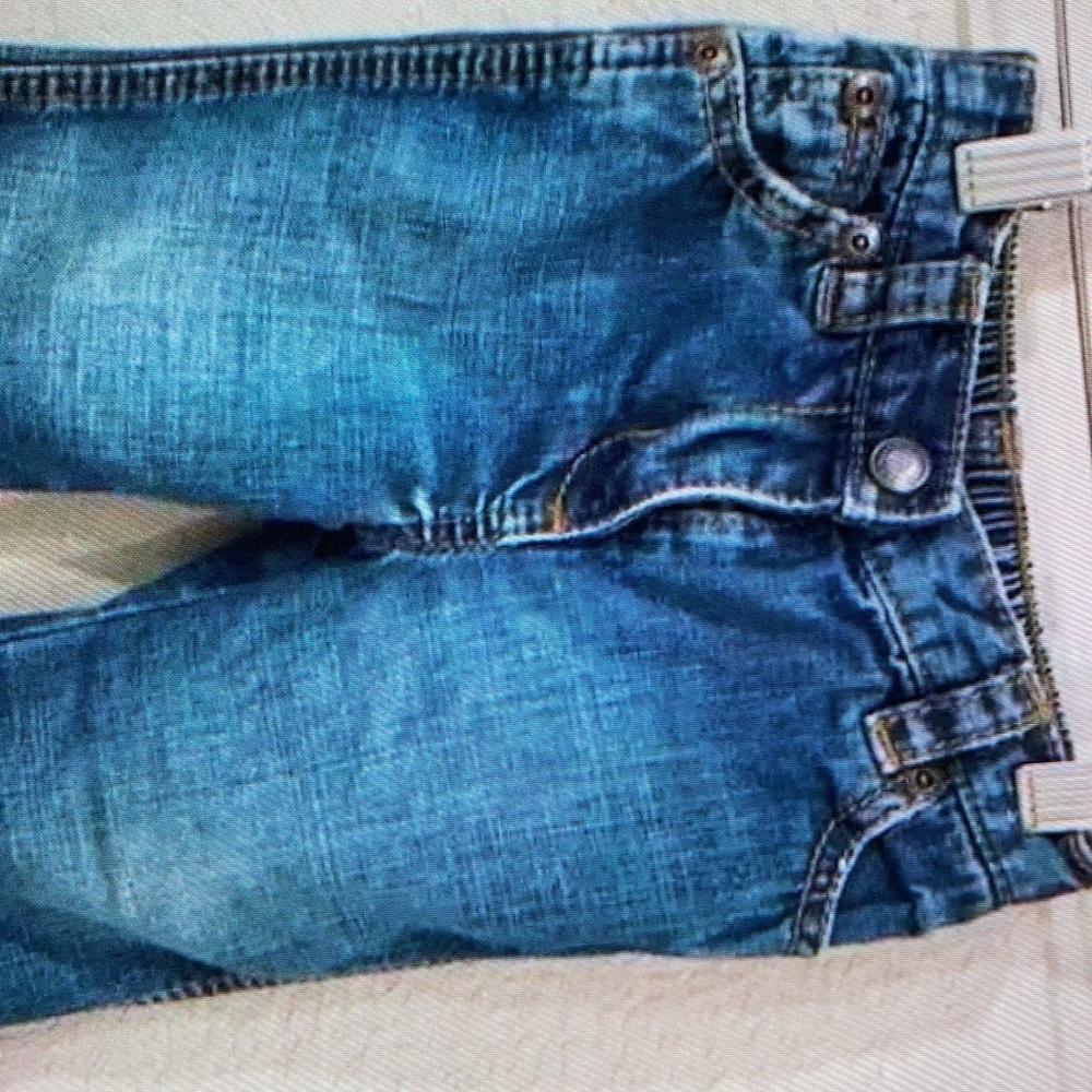 Light distressing on front left hem denim cotton shorts